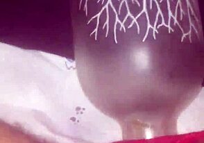 Bisexual slave submits to anal play with a bottle. His master pushes limits in a dark dungeon.