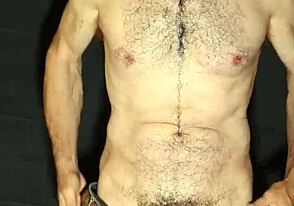 This gay guy shows off and jerks his huge cock