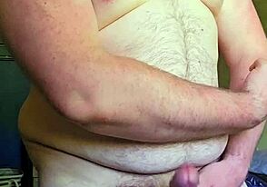 Horny gay muscle chub shooting a massive load